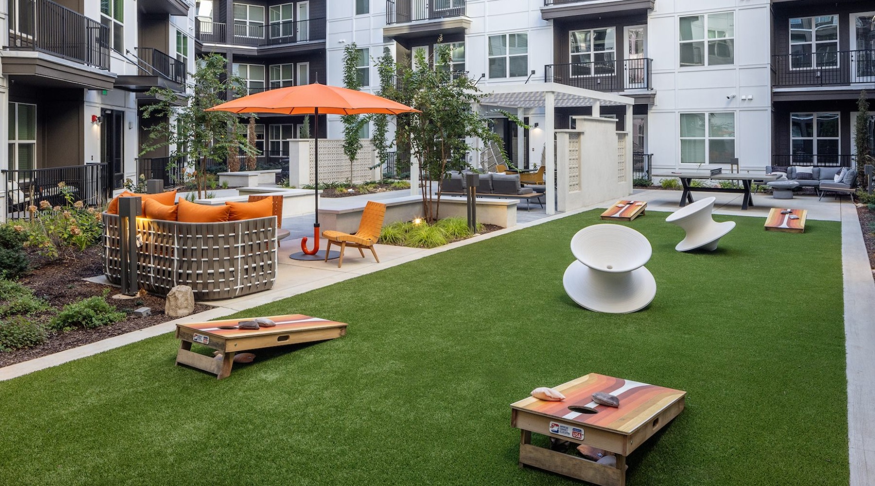The outdoor lounge at Broadstone Berry Hill apartments in Nashville, TN, featuring outdoor furniture and games.